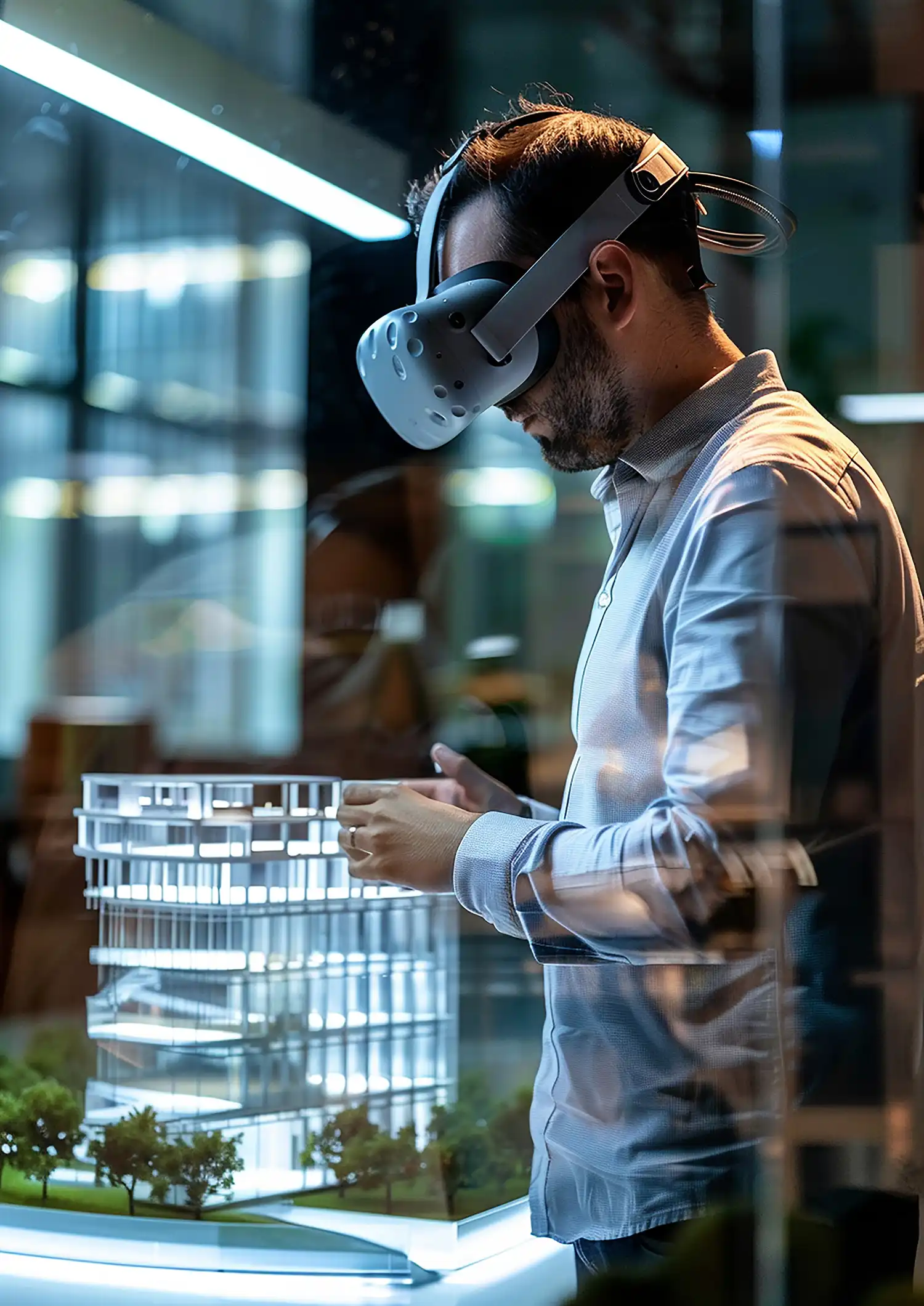 Man wearing AR/VR headset standing in front of a table with a 3D architectural model, showcasing AR/VR applications in architecture services by Evovise